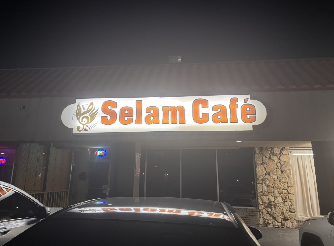 Selam Café Interior with Orange Booths and High Chairs